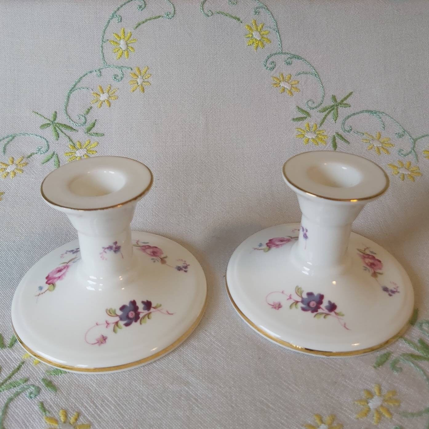 A Pair of Coalport Candlesticks Handpainted with Flowers