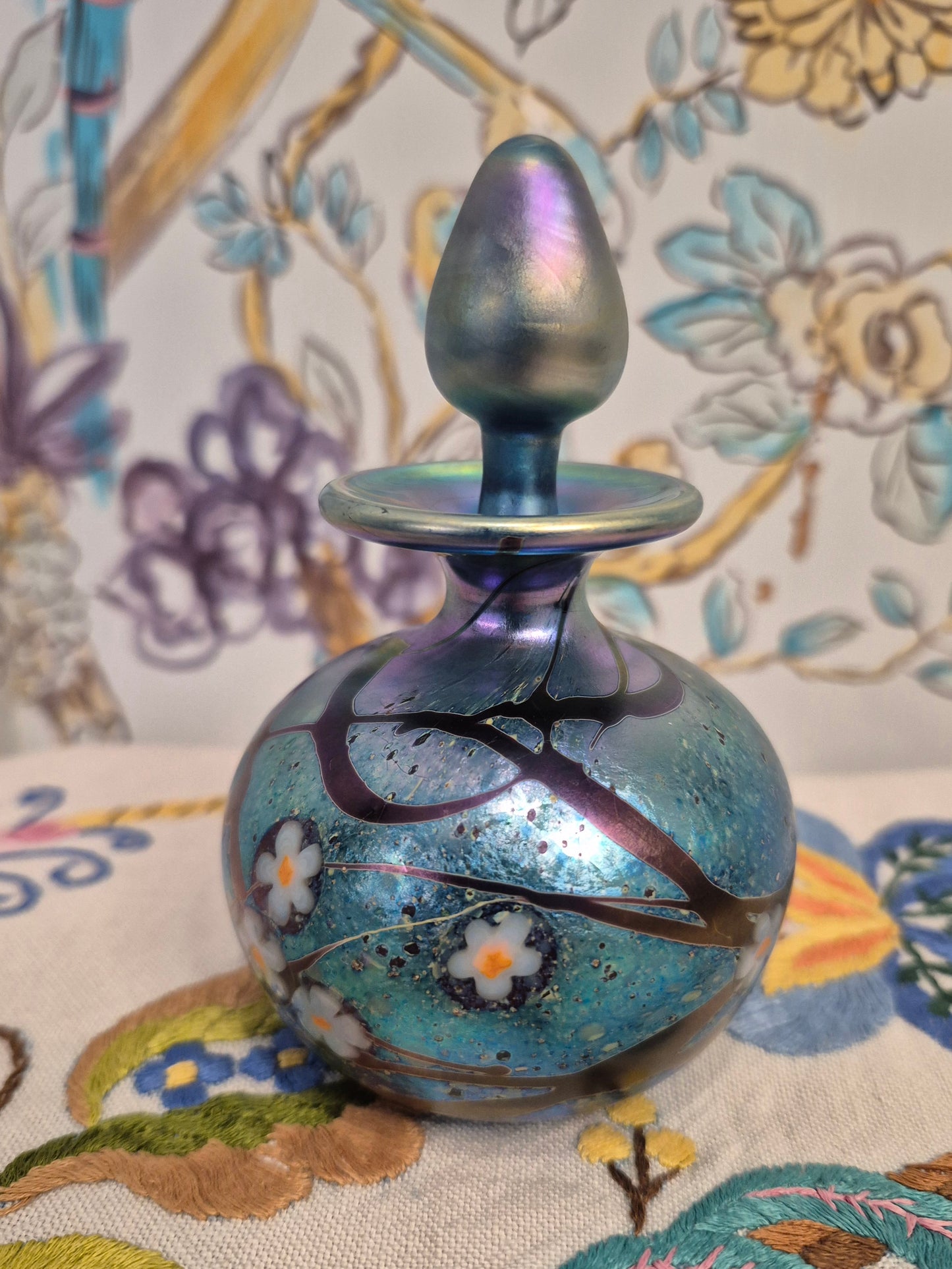 A 1984 Okra Glass Perfume Bottle in a Flower Design by Richard Golding