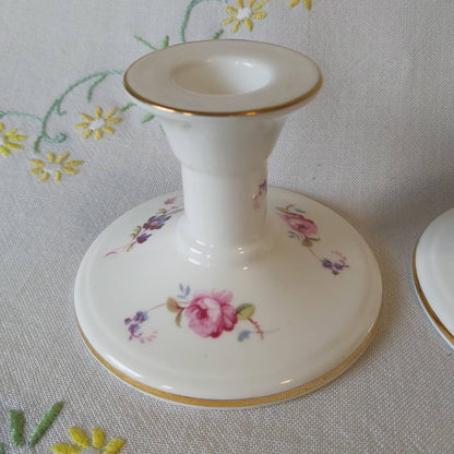 A Pair of Coalport Candlesticks Handpainted with Flowers