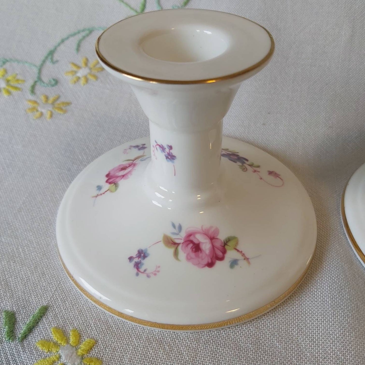 A Pair of Coalport Candlesticks Handpainted with Flowers