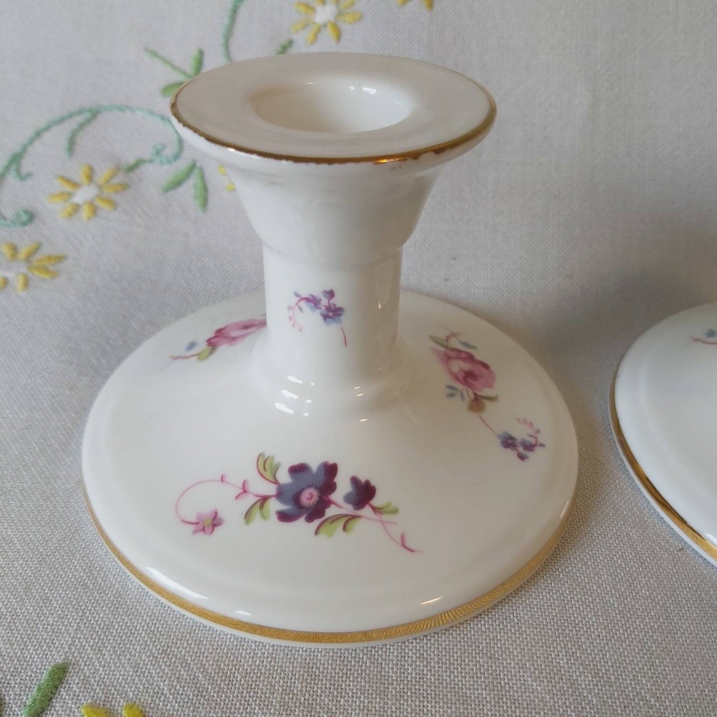 A Pair of Coalport Candlesticks Handpainted with Flowers