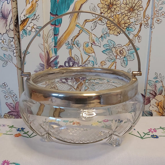 A Large Antique Cut Glass Bowl with Silver Plated Mounts and Swing Handle