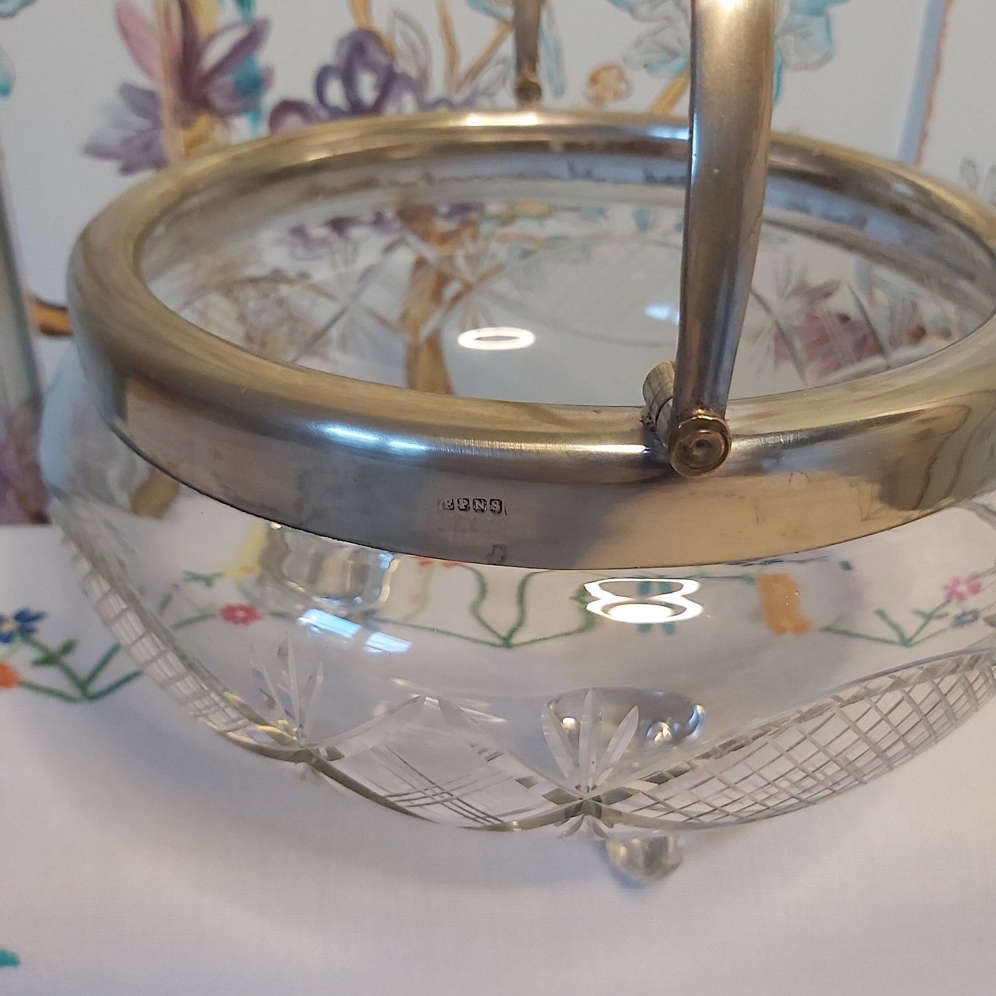 A Large Antique Cut Glass Bowl with Silver Plated Mounts and Swing Handle