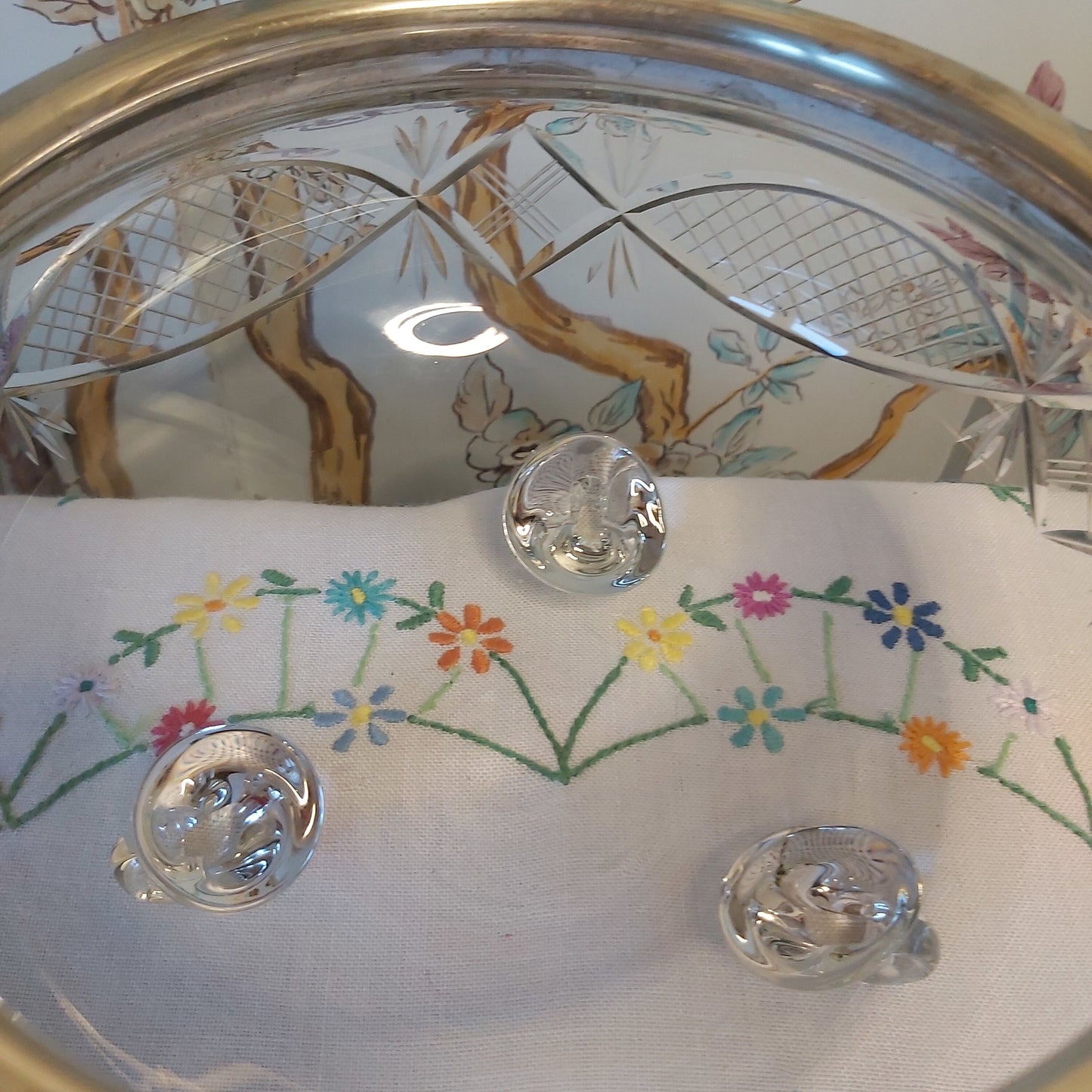 A Large Antique Cut Glass Bowl with Silver Plated Mounts and Swing Handle