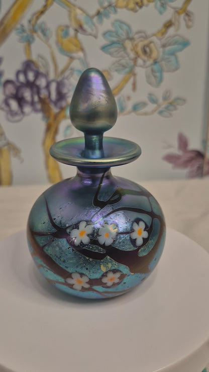 A 1984 Okra Glass Perfume Bottle in a Flower Design by Richard Golding